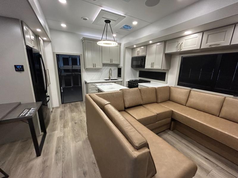 Brinkley Model G 3950 interior with a massive U-shape sofa and a kitchen.