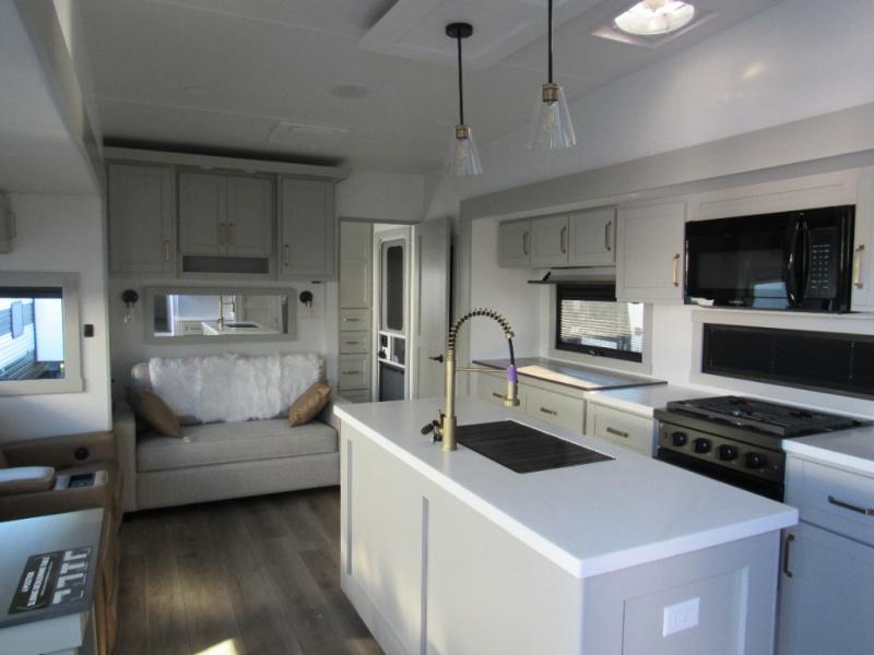 Brinkley Model Z 3515 fifth wheel interior with seating, a large kitchen, and a spacious kitchen island.